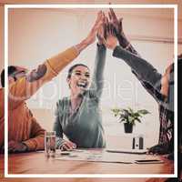 Cheerful business team doing high five in creative office