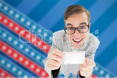 Composite image of geeky hipster smiling and showing card