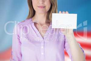 Composite image of portrait of beautiful businesswoman showing blank sign