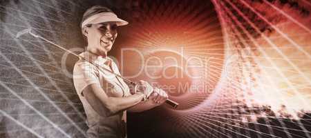 Composite image of woman golf player looking the camera