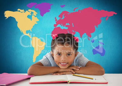 Schoolgirl at desk in front of colorful world map