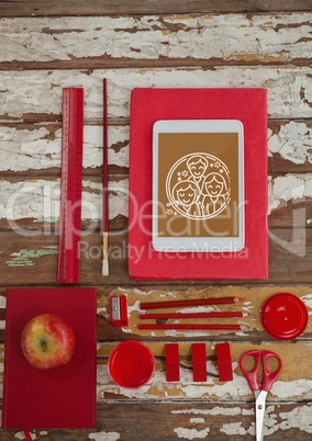 Tablet on a school table with school icons on screen