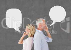 Couple with speech bubble talking on the phone against grey background