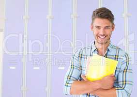 male student holding files in front of lockers