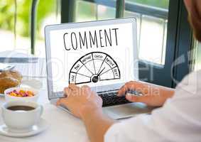 Comment text and ratings graphic on laptop screen with hands