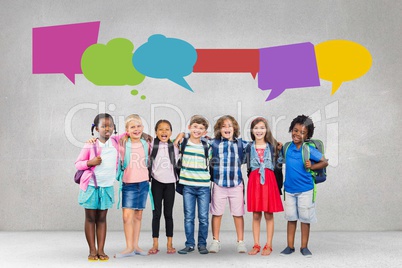 Happy students with speech bubble against grey background