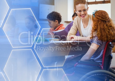 School teacher with disabled student in wheelchair in class