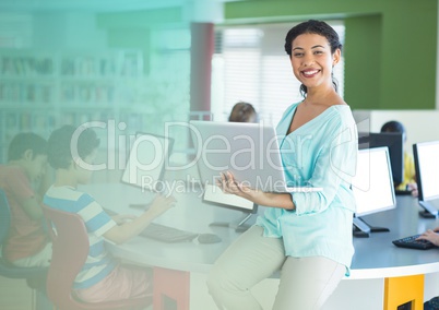 Teacher with class in computer room