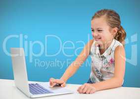 Girl on laptop with blue wall