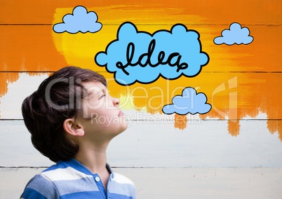 Boy looking at colorful idea clouds graphics