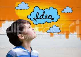 Boy looking at colorful idea clouds graphics