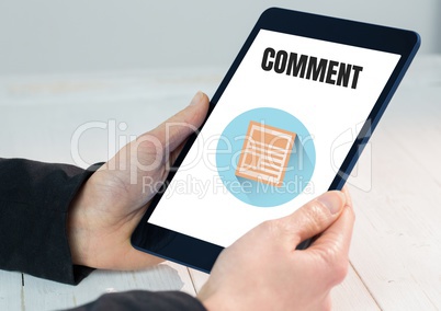 CComment text and graphic on tablet screen with hands