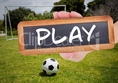 play text on blackboard with soccer field and football