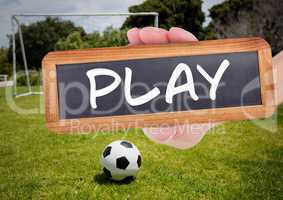 play text on blackboard with soccer field and football