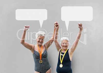 Excited elder women with speech bubbles against grey background