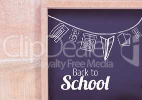 back to school text and stationery  on blackboard