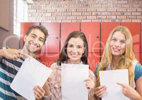 students holding exam sheets in front of lockers