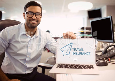 Man holding a computer with travel insurance concept on screen
