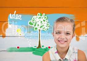 Girl in front of colorful idea graphics on orange painted wall