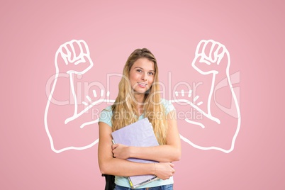 Happy student woman with fists graphic standing against pink background