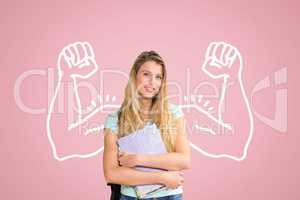 Happy student woman with fists graphic standing against pink background