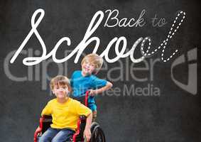 Back to school text on blackboard with disabled boy and friend in wheelchair