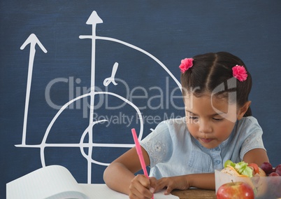 Student girl at table writing against blue blackboard with school and education graphic