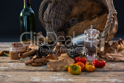 Spice by container on wooden table