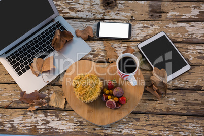 Food with coffee cup on wooden tray by technologies