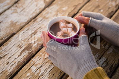 Cropped hand having hot chocolate