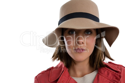 Close up portrait of young woman wearing hat