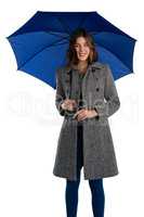 Portrait of smiling young woman holding umbrella