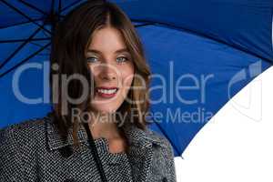 Close up portrait of smiling woman with blue umbrella