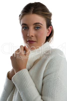 Portrait of young woman wearing sweater