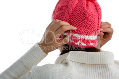 Rear view of woman wearing knit hat