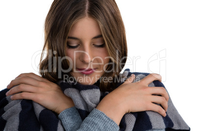 Close up of young woman covering with scarf