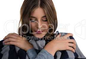 Close up of young woman covering with scarf