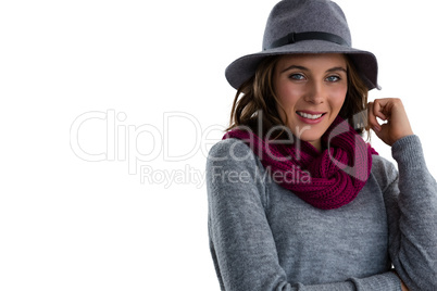 Portrait of smiling woman wearing hat and scarf