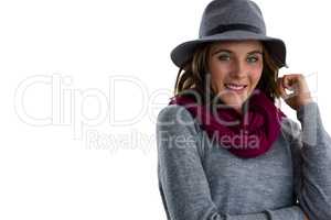 Portrait of smiling woman wearing hat and scarf