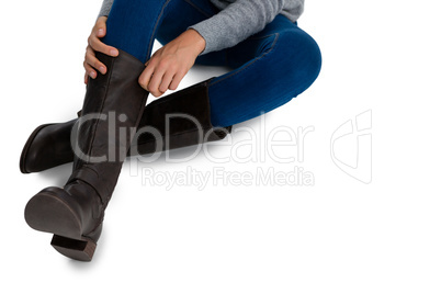 Low section of woman wearing boots