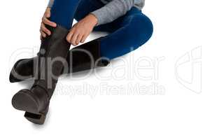Low section of woman wearing boots