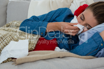 Woman rubbing rose with tissue