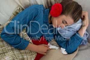 Directly above shot of woman sleeping on sofa