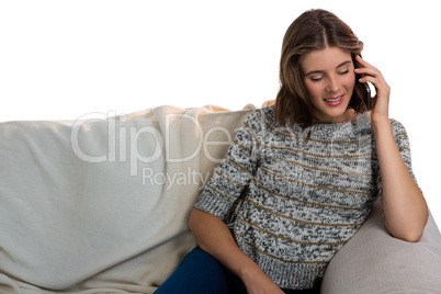 Smiling woman using mobile phone