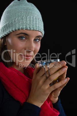 Portrait of woman holding coffee cup