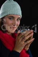 Portrait of woman holding coffee cup