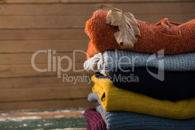 Stack of sweater on table