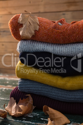 Stack of sweater by wall