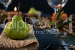 Close up pf pear served on burlap in plate