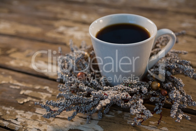 Close up of black coffee on dried plant Close up of black coffee on dried plant